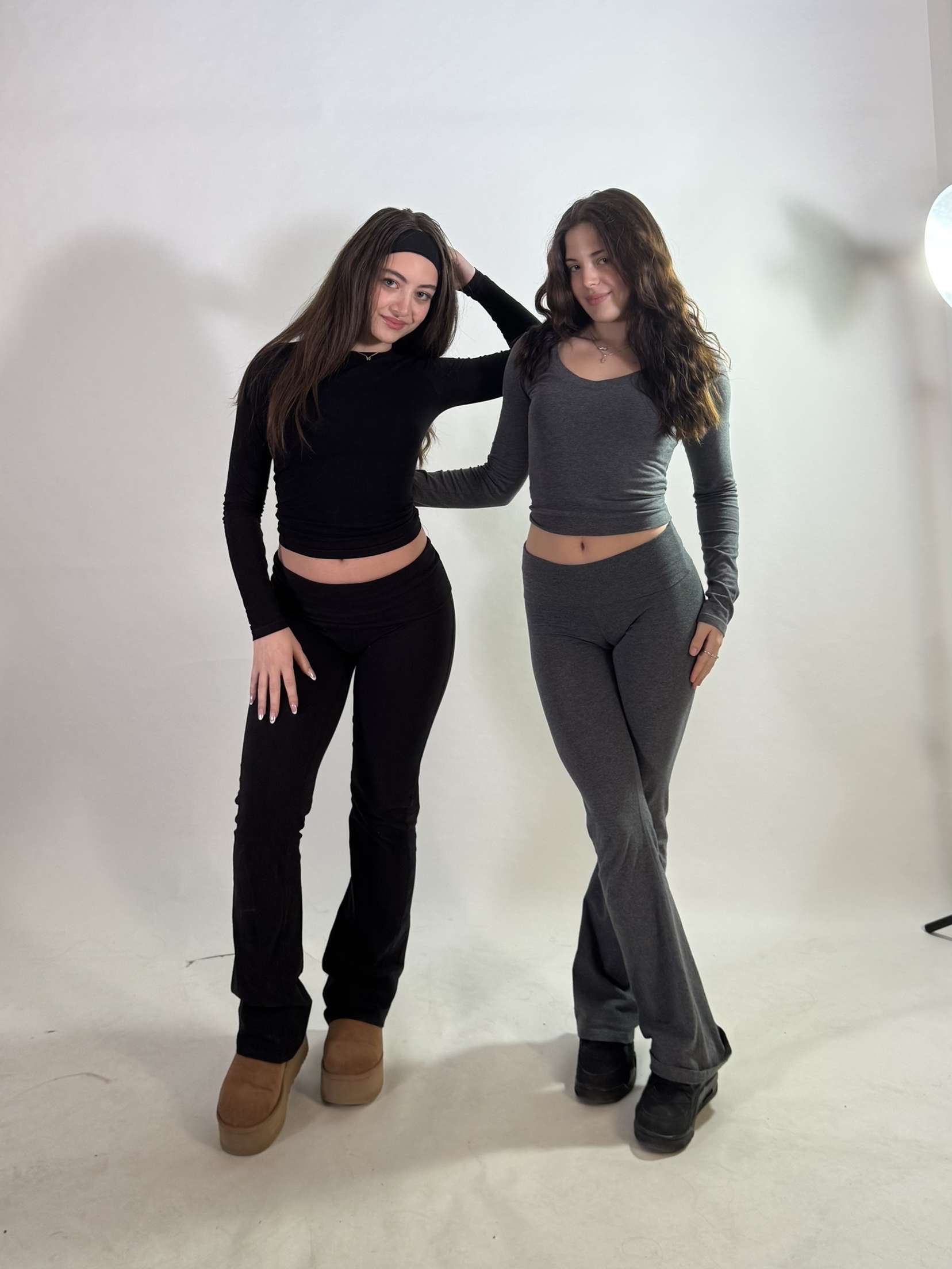 Models wearing black and gray casual outfits